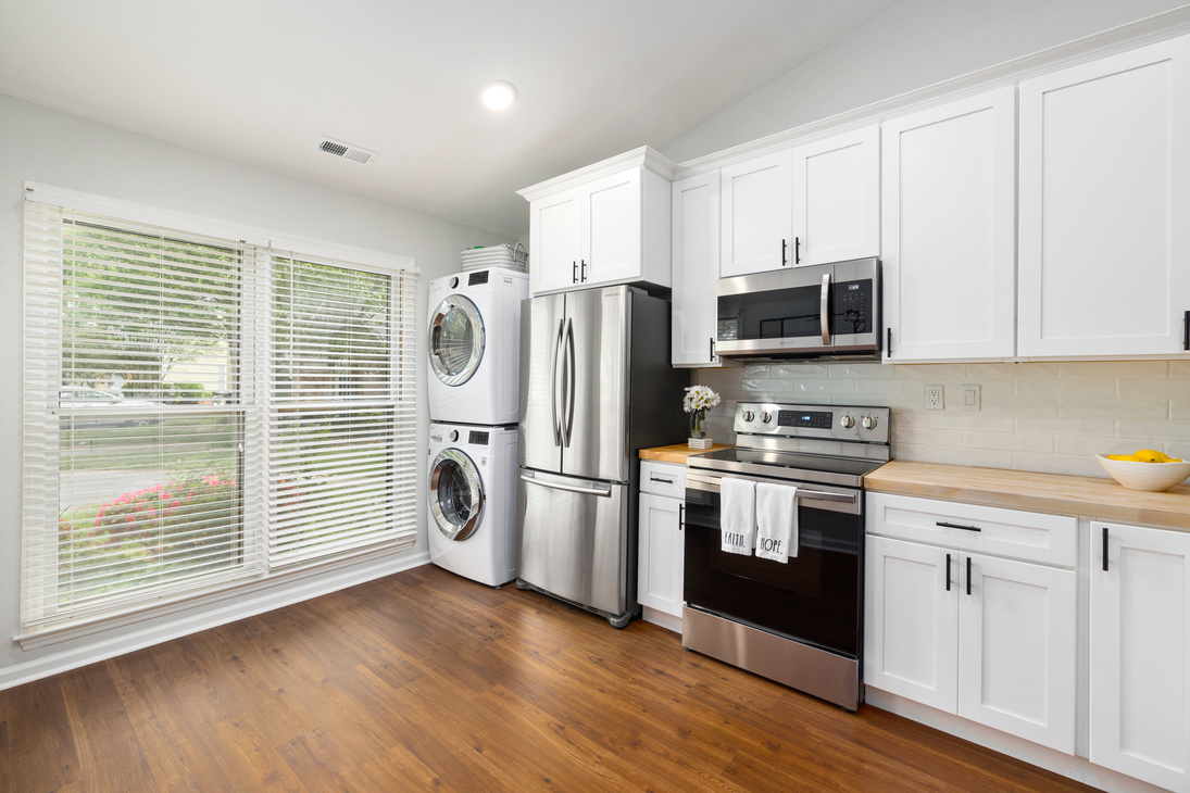 A White Kitchen Cabinets Near the Appliances